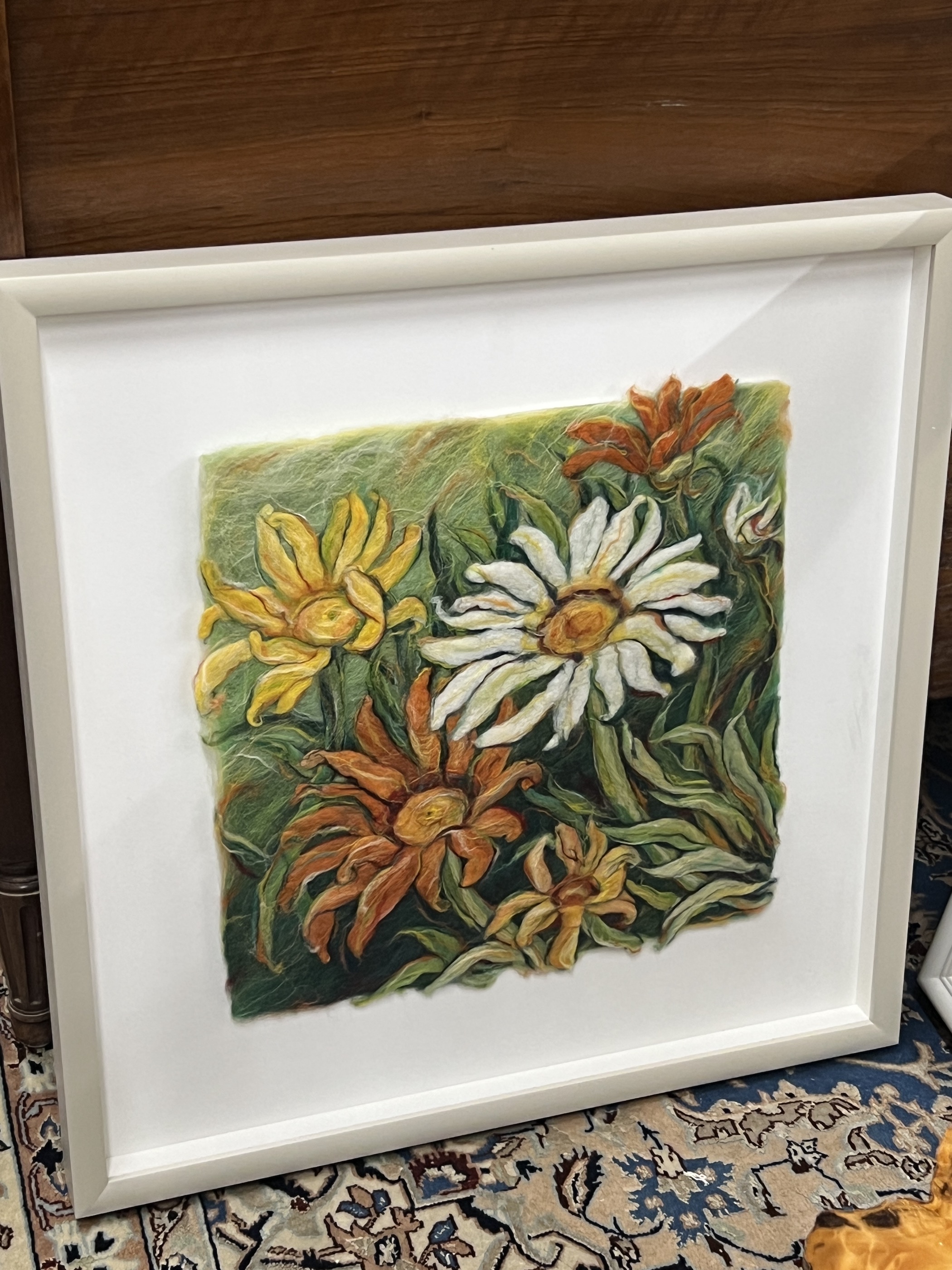 A framed velvet panel fragment and a framed floral woolwork panel, larger 38 x 59cm